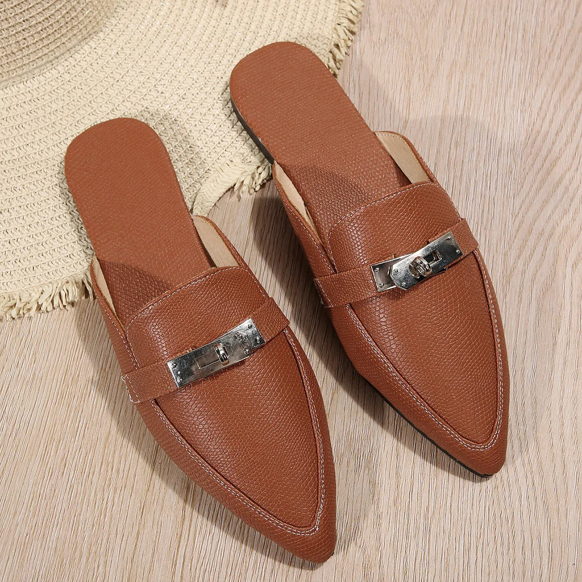 Light brown women's pointed-toe semi-slippers with a low heel and rubber sole