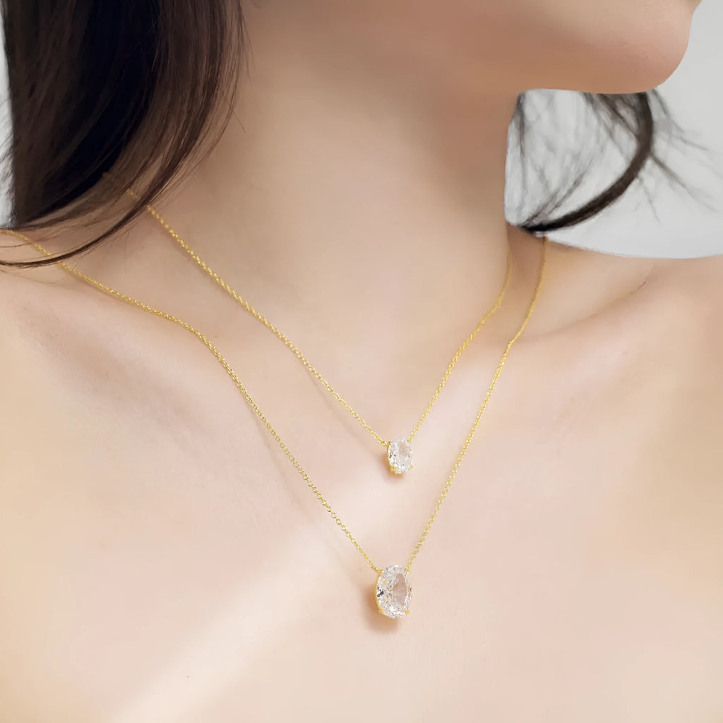 Women's S925 sterling silver necklace with a geometric oval ice flower pendant in gold or platinum finish.
