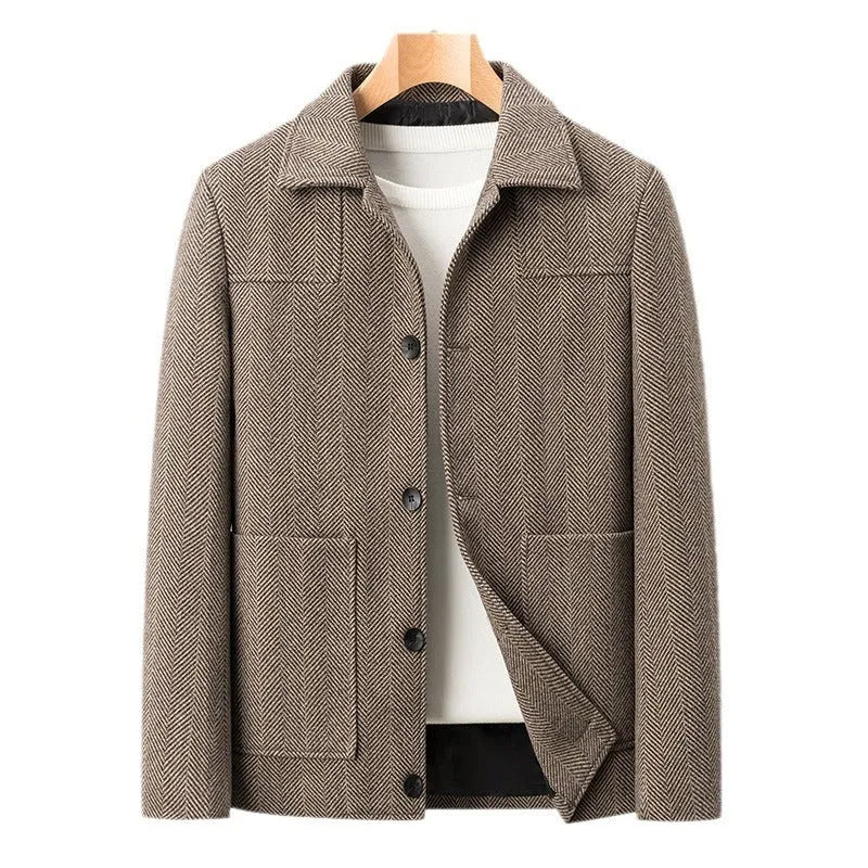 Men's slim lapel woolen jacket in gray with non-ironing finish and side patch pockets on a plain background