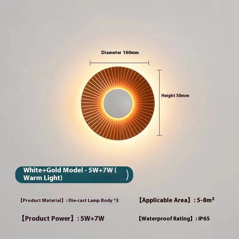 Round aluminium LED wall lamp in a dual-colour finish mounted on a wall.