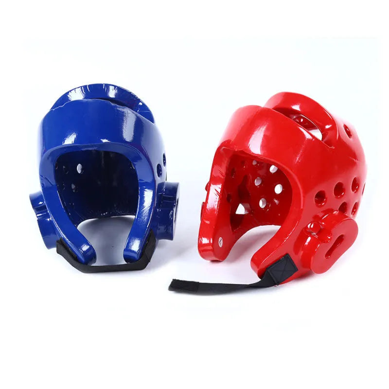 Karate protective gear set showing red leg guards, helmet and boxing gloves for martial arts training