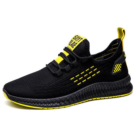 Men's low-top casual trainers with Flying Weave upper, cross straps, and striped pattern in black, orange, or yellow.