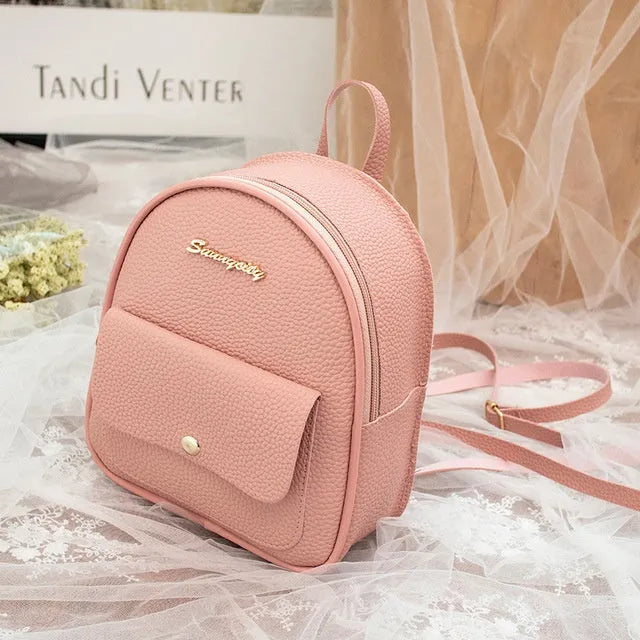 Women's small black PU backpack purse with letter design and zipper closure