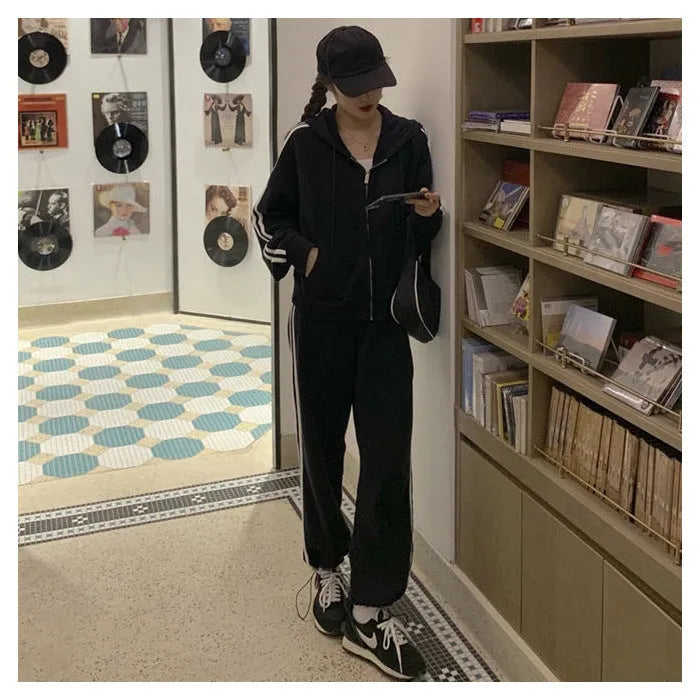 Striped polyester two-piece pants suit set for women in light gray or black with top and trousers coordinated