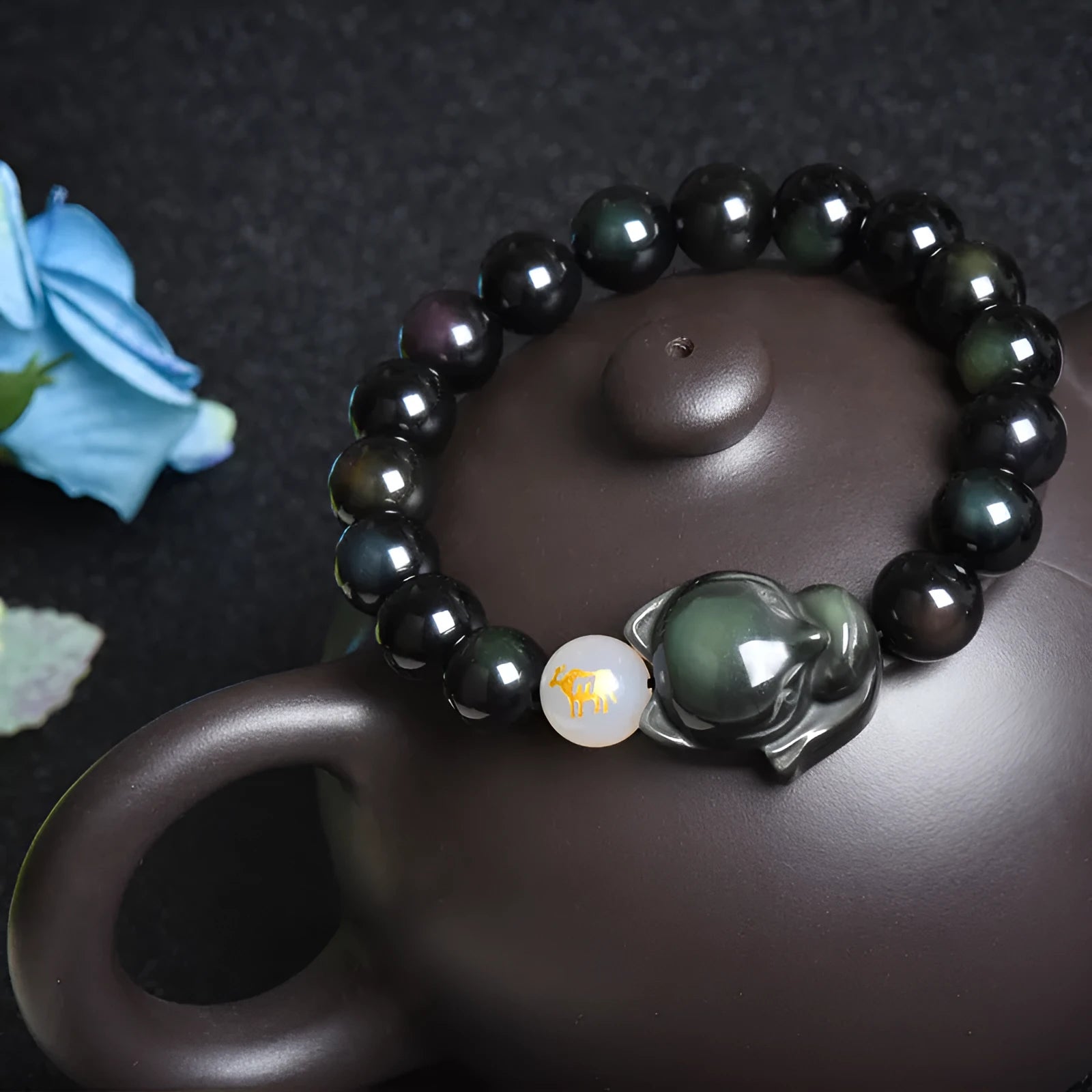 Natural obsidian zodiac bracelet in 10mm beads with national style design.