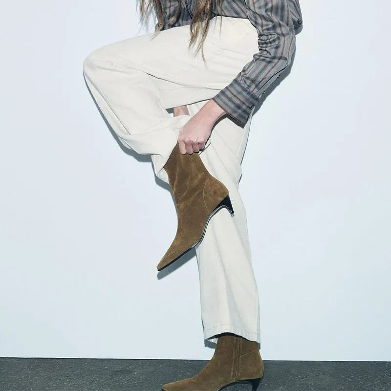Brown square toe mid-calf boots with a side zipper and pointed stiletto kitten heel on a white background.