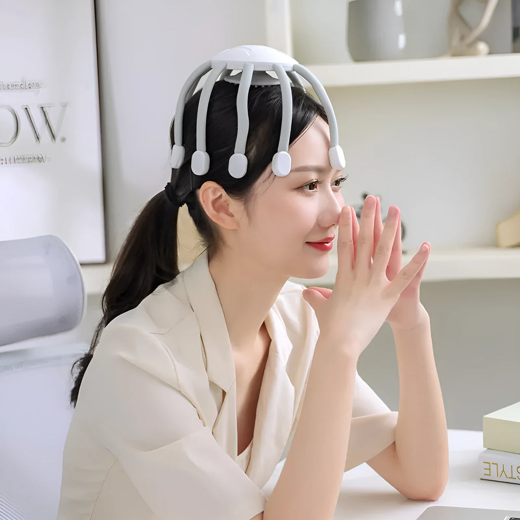 Black and white head massagers with multiple claws and USB cable for charging.