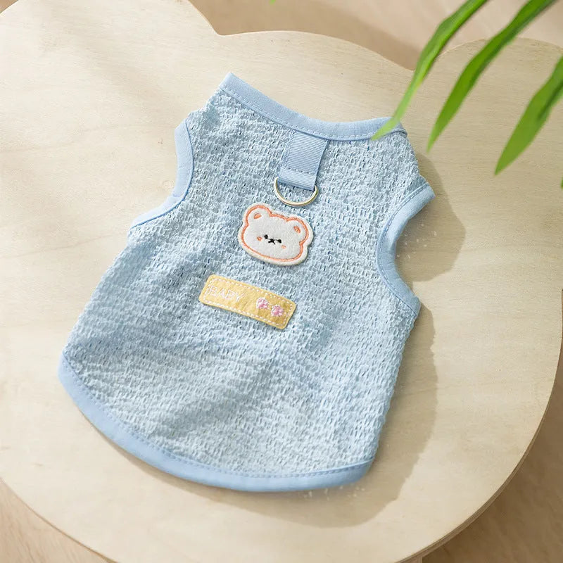 Colourful knitted cat clothes with a bear patch, showing hollowed-out breathable fabric.