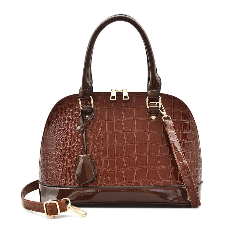 Large shiny black PU crossbody bag with a structured shell shape