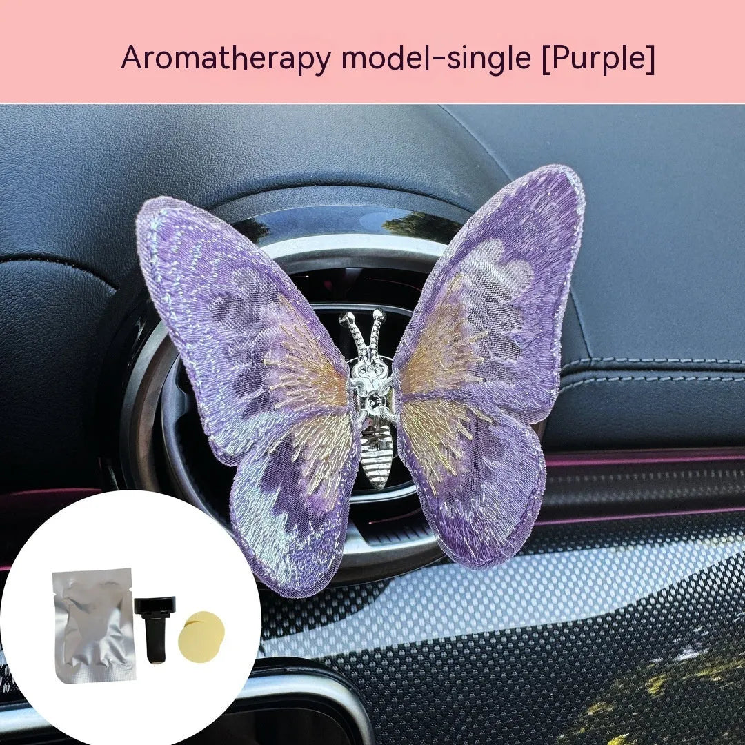Moving embroidery butterfly decoration on car centre console air vent in pink fabric