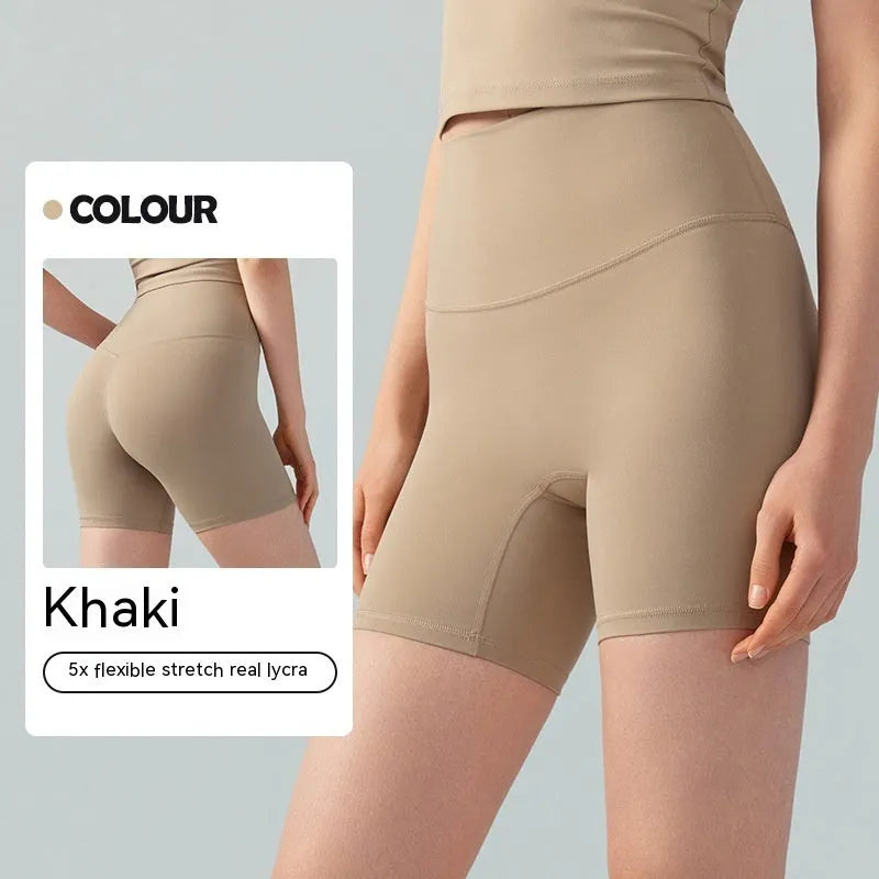 Women's lycra yoga tight shorts in leaf green colour showing high waist and short length design