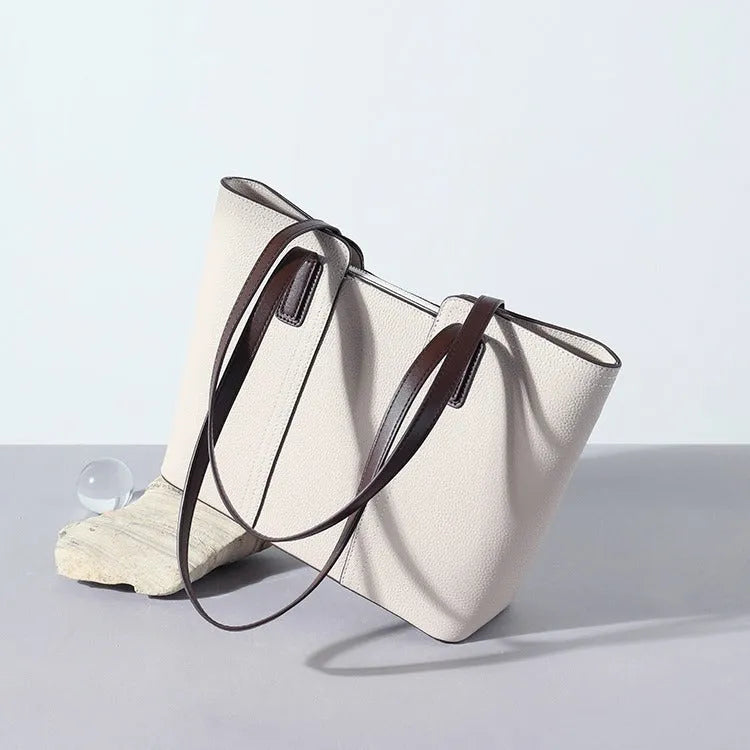 Women's genuine leather shoulder bag in khaki colour showing box-type design and organised interior compartments