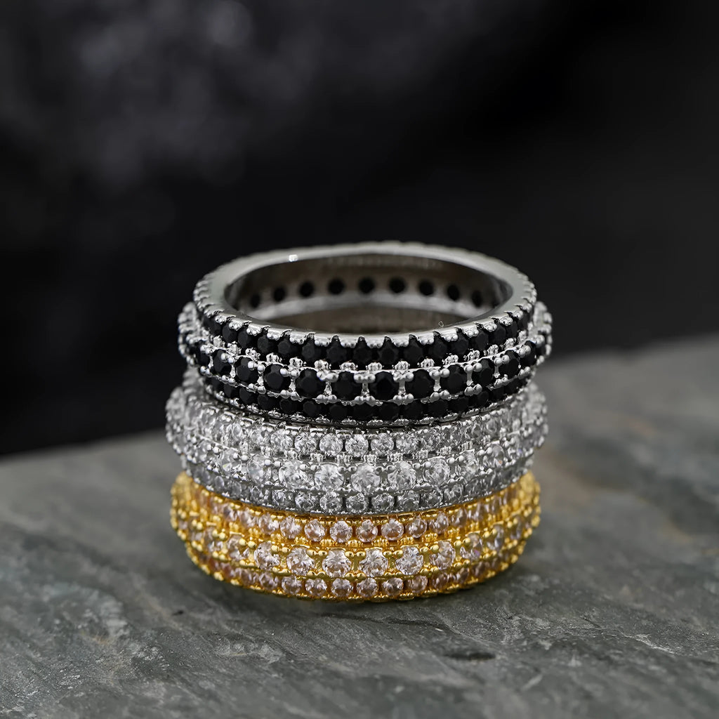Geometric triangle engagement ring with zircon stone in yellow gold finish on a copper band.