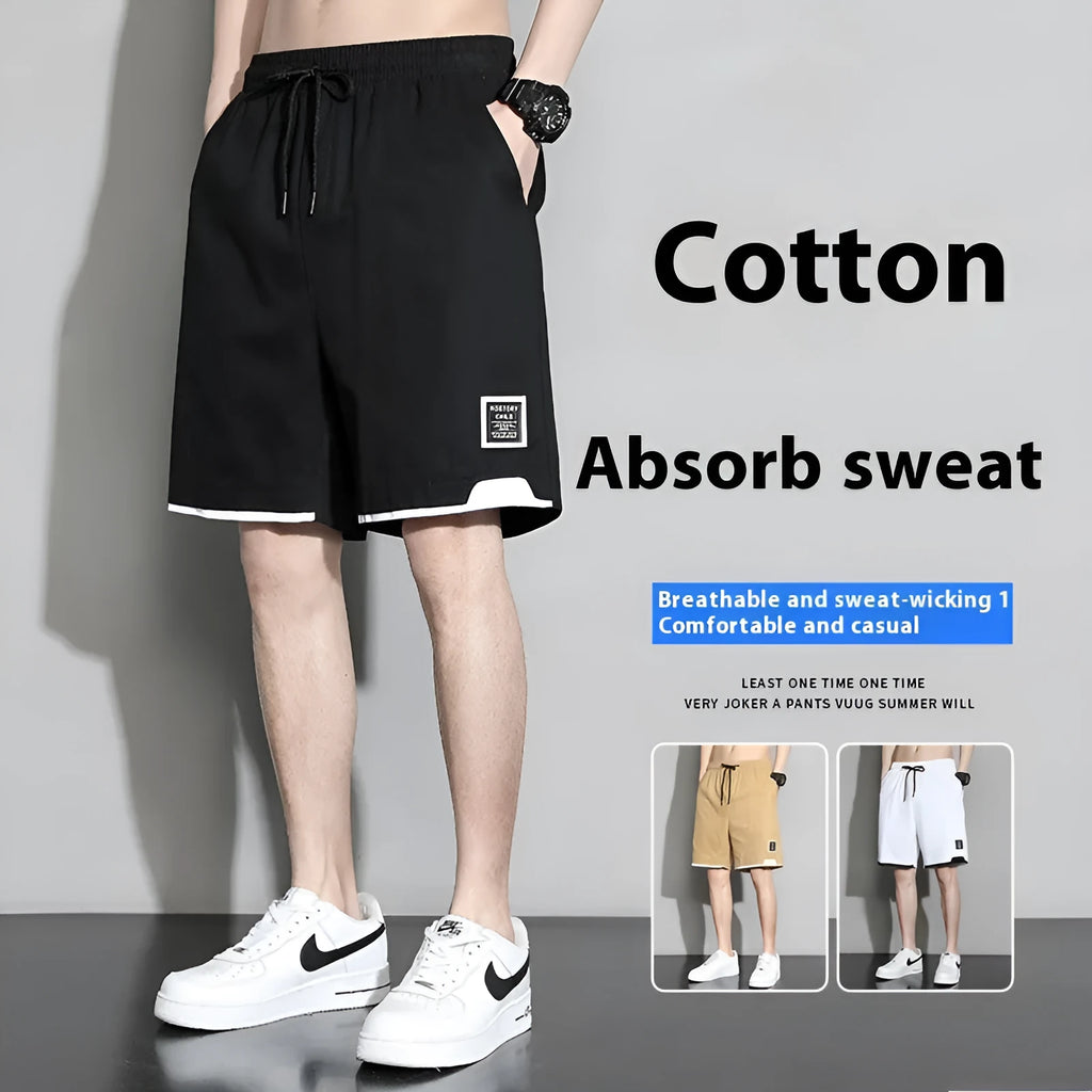 Boys cotton shorts in black, shown in a casual setting for summer.