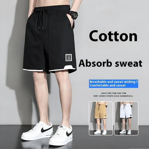 Boys cotton shorts in black, shown in a casual setting for summer.