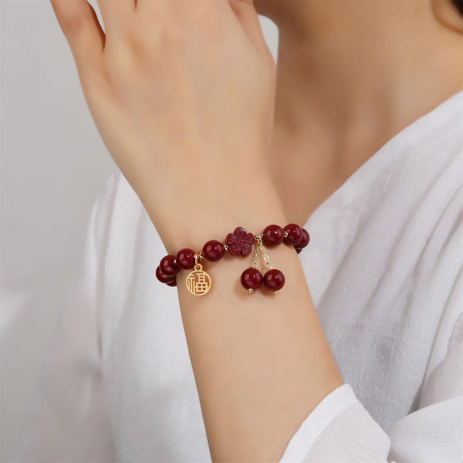 Women's cinnabar bracelet with purple gold sand colour and Fu character design elements