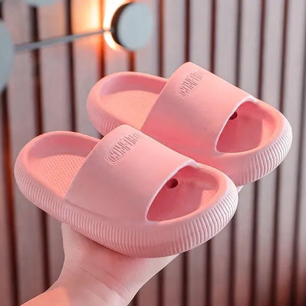 Children's bright coloured EVA slippers with non-slip soles in blue, green, orange, pink, and yellow.