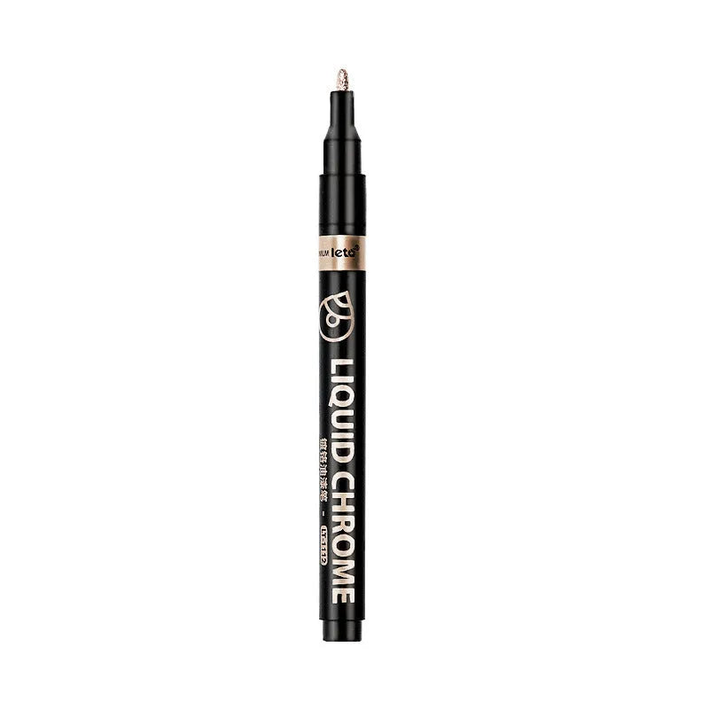 Metal mirror chrome plated marker pen with reflective metallic tip on a smooth surface