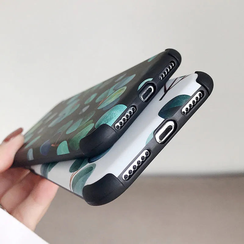 Black silicone leaf design phone case for iPhone models on a plain background.