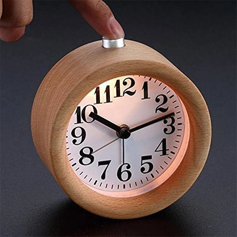 Solid beech wood silent snooze alarm clock with a 4-inch white dial on a wooden base.