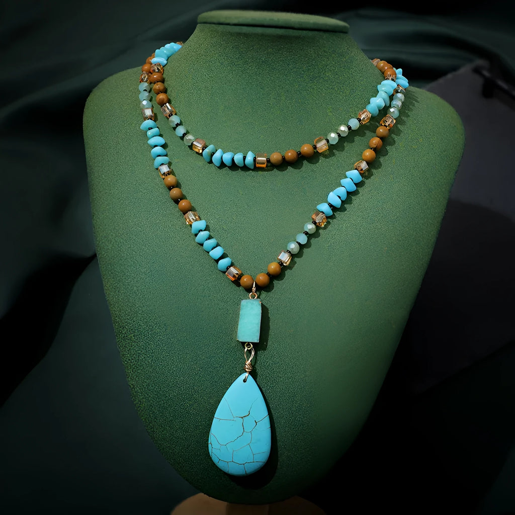 Turquoise water drop shaped pendant necklace with geometric design and ball bead chain