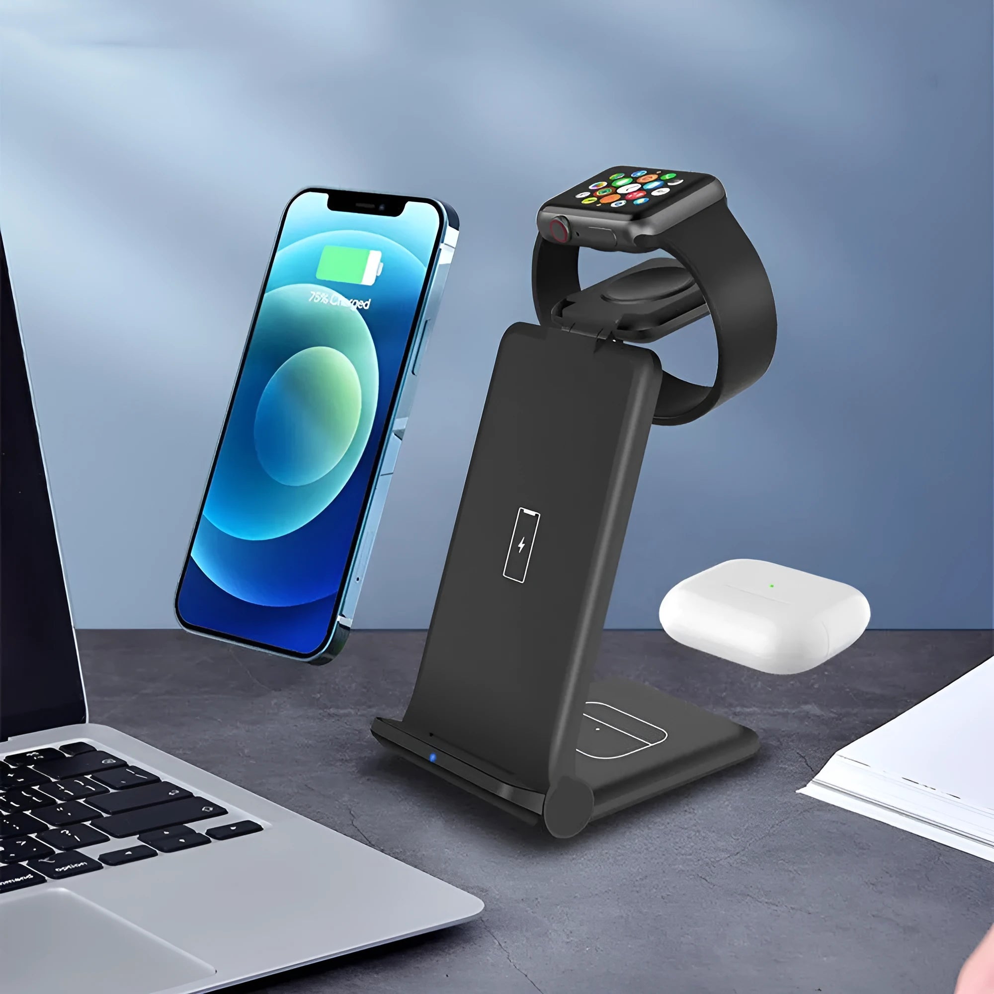Black and white 3 in 1 foldable wireless charging station for iPhone, AirPods and Apple Watch on a desk.