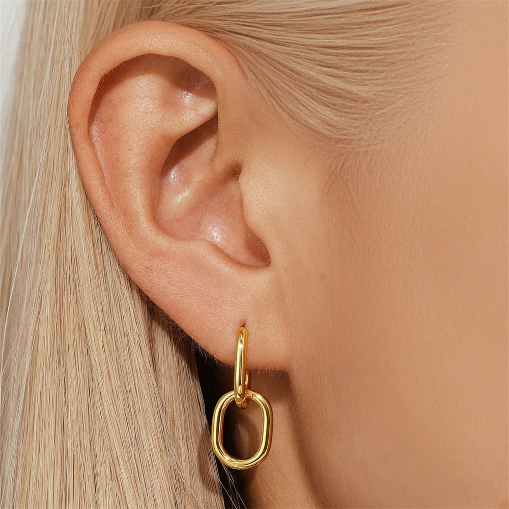 Golden brass diamond earclip earrings with geometric round design and butterfly backings