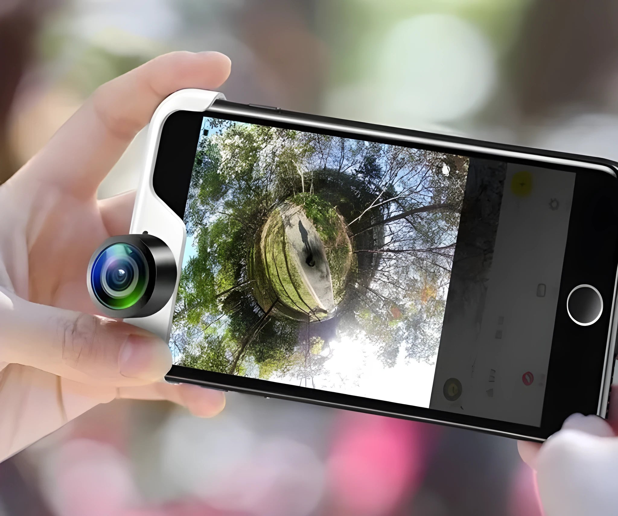 Panoramic camera lens attached to an Apple iPhone for taking 360-degree photos