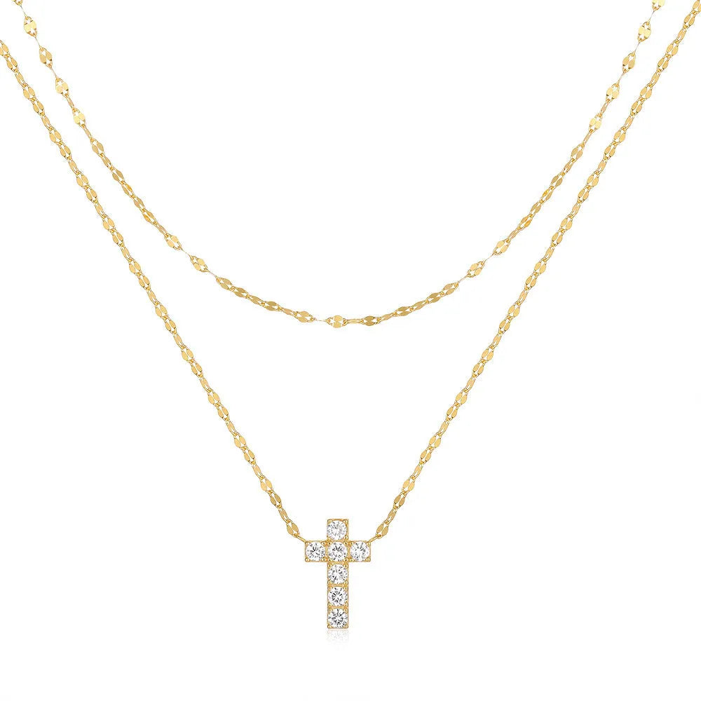 Double layer geometric twin diamond cross pendant on a sterling silver clavicle chain.