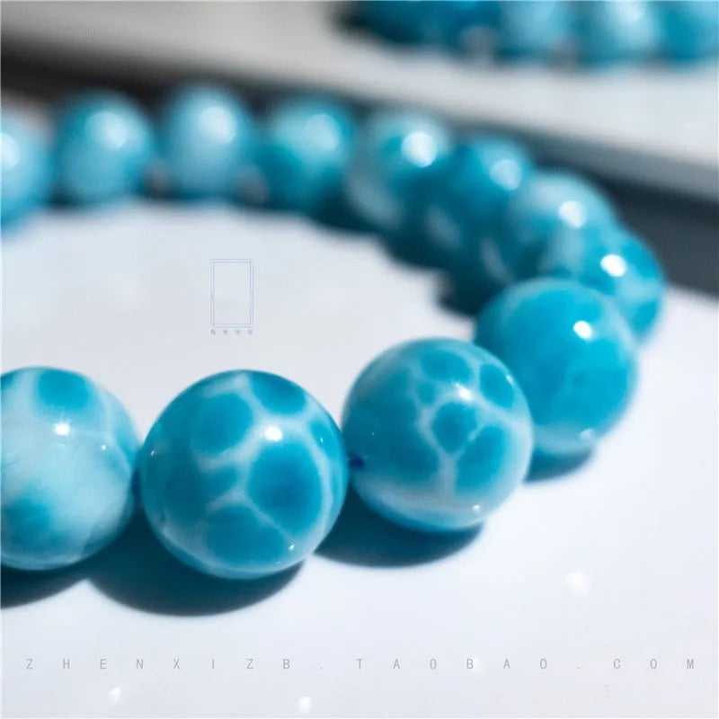 Blue handmade bodhi bracelet with natural crystal sea-pattern stone and pearl beads in Maillard style.