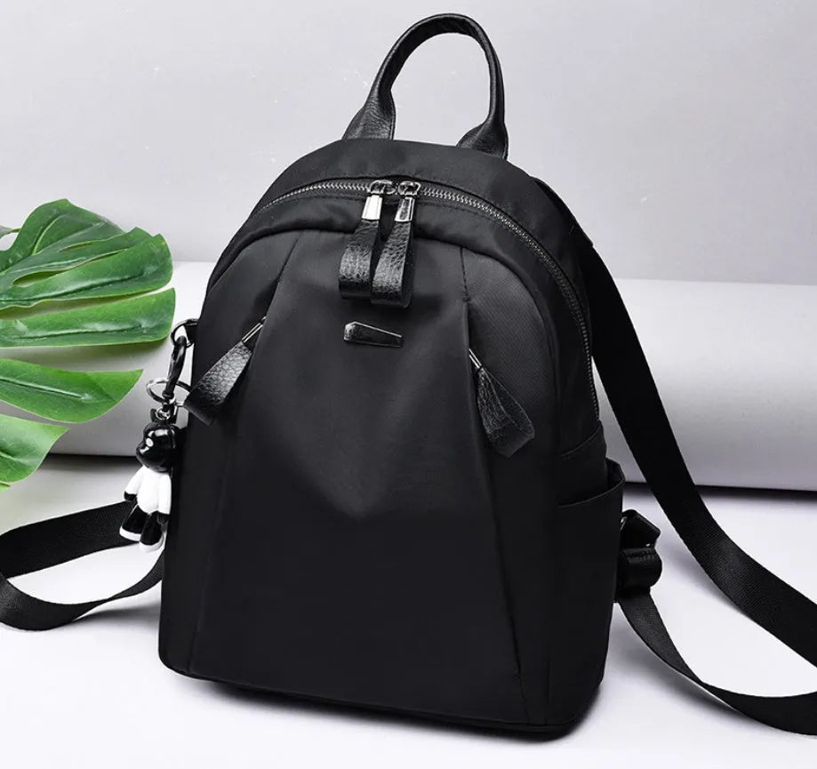 Medium black Oxford cloth fashion rucksack with internal phone and ID pockets