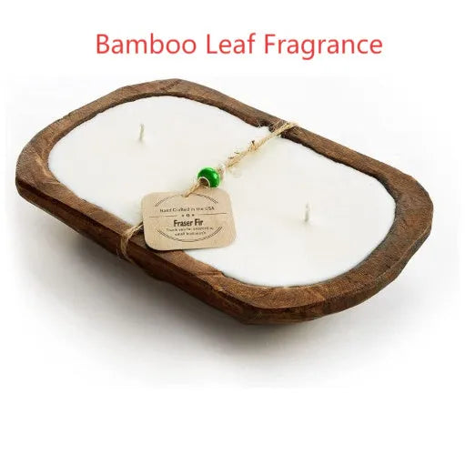 Lavender-coloured wooden basin containing a soy wax aromatherapy candle with three wicks.