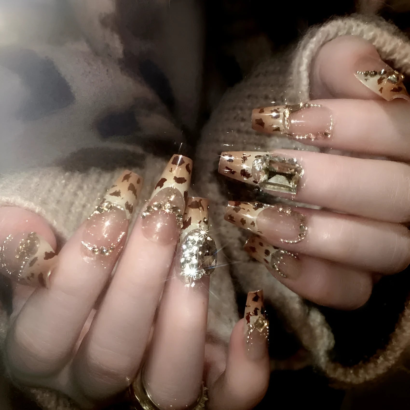 Leopard print plastic wearable nail armour set with advanced flash finish on women's hands