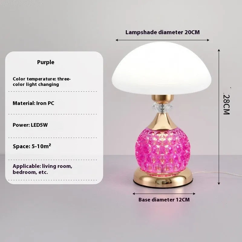Light luxury mushroom table lamp with carved base in transparent colour on a wooden bedside table