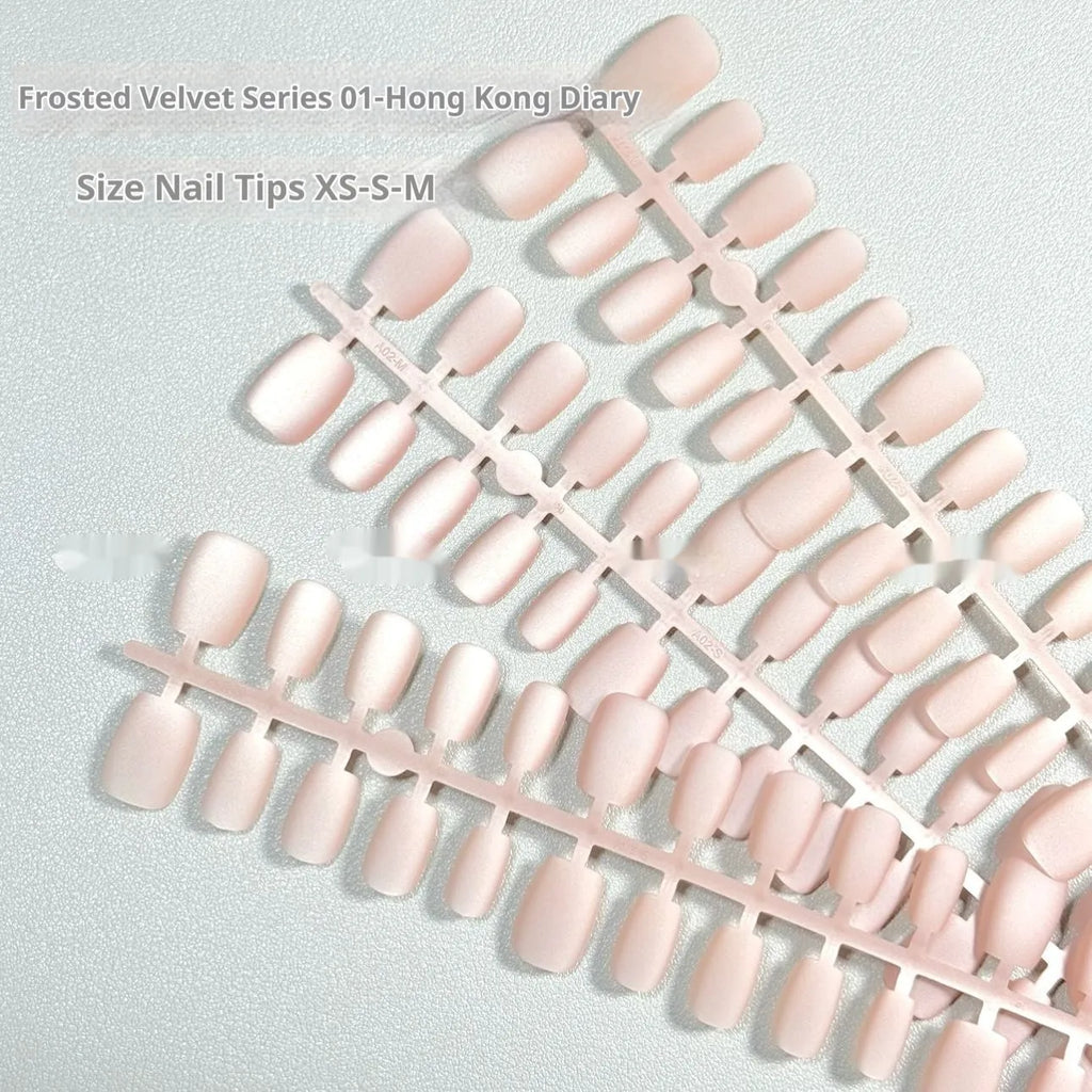 Set of frosted velvet finish press-on nails with Cat's Eye and aurora effects, showing short ladder XS, S, and M sizes.