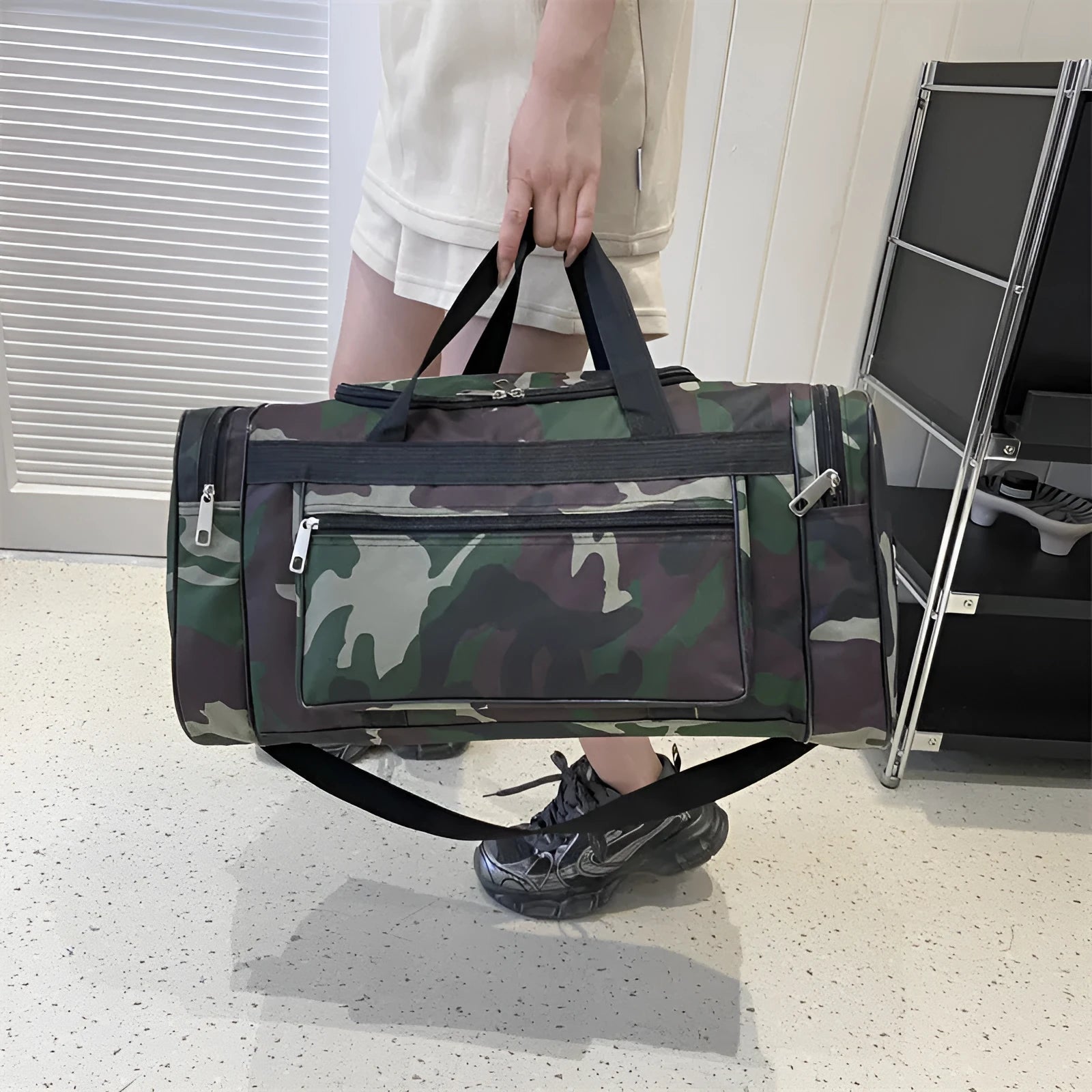 Green camouflage waterproof fabric luggage bag with striped lining.
