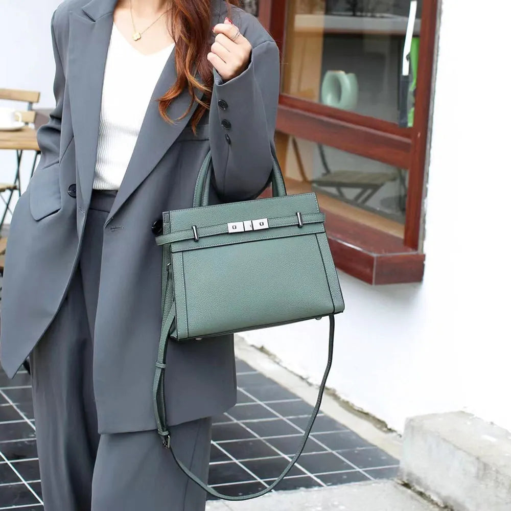Genuine leather small square shoulder bag in almond green colour showing internal compartments