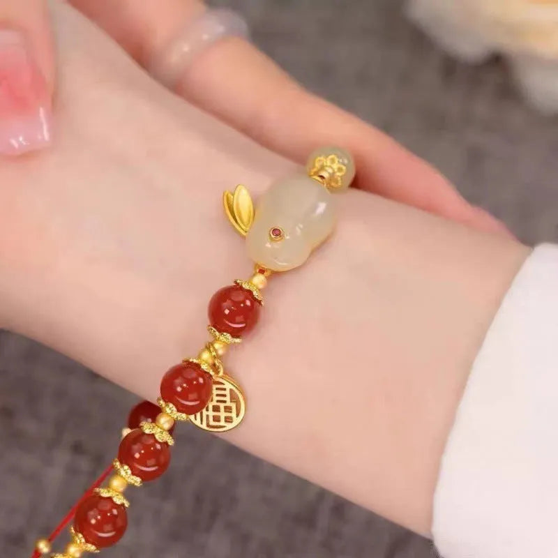 Chinese style glass bracelet with bamboo joint details in a red Lvzhu Duobao design.
