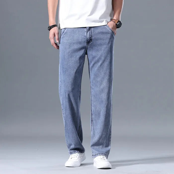 Men's loose straight-leg jeans in a lyocell-blend denim, shown in light blue colour with a zipper fly.