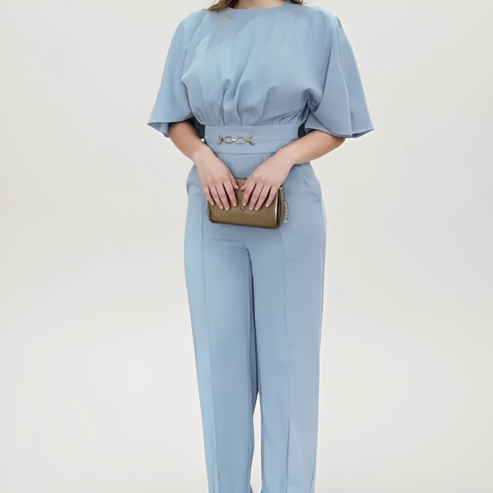 Blue polyester men's suit comprising trousers and a long-sleeve shirt, laid flat.