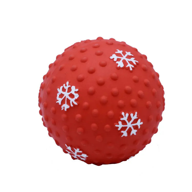 Red dog toy ball with squeaker and air vents, 7 cm diameter, floating on water