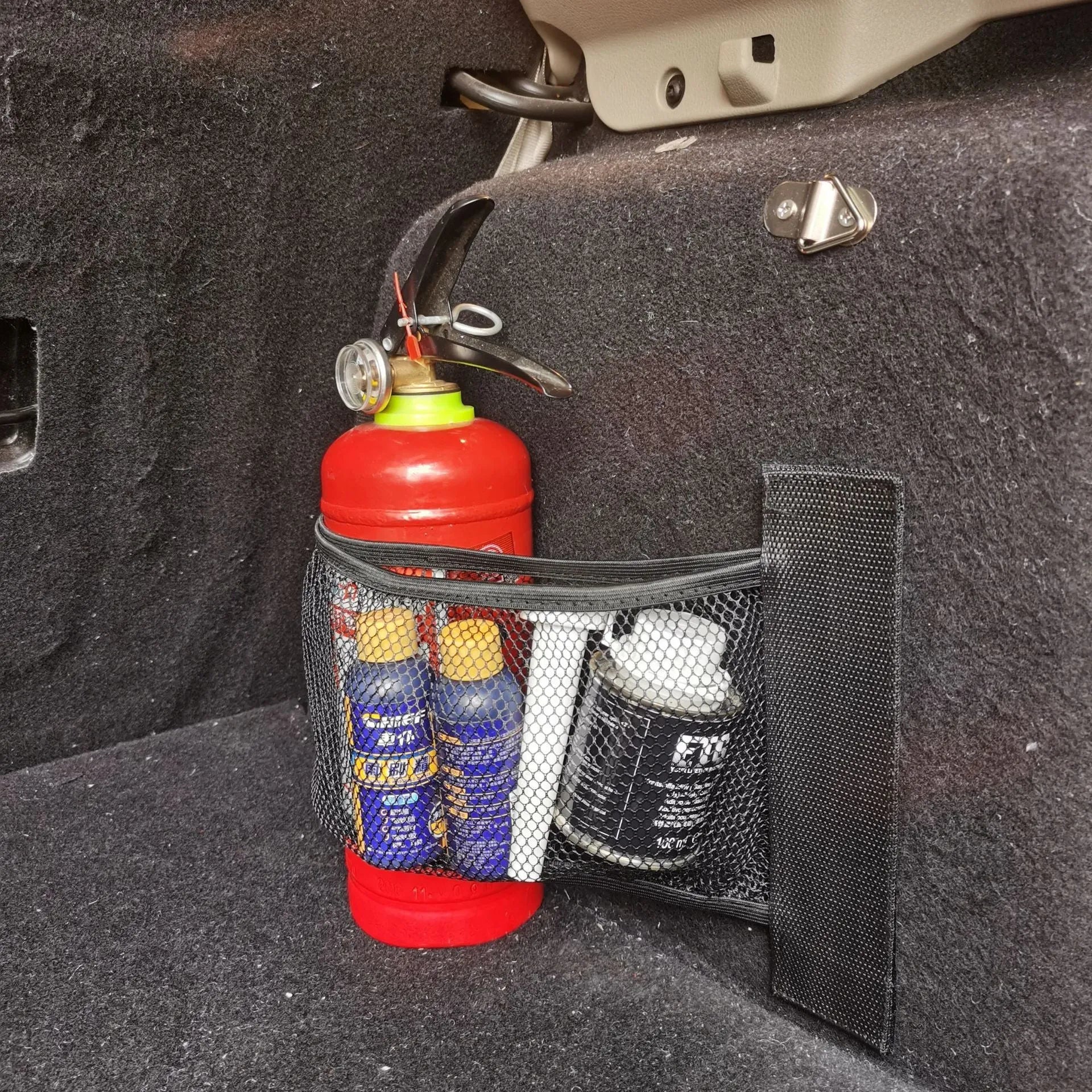 Car trunk elastic storage net in two sizes for organising loose items in vehicle boot
