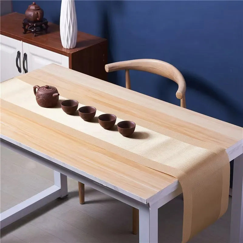 PVC non-slip dish mat in modern simple style on a dining table, showing gradient bamboo black colour option.