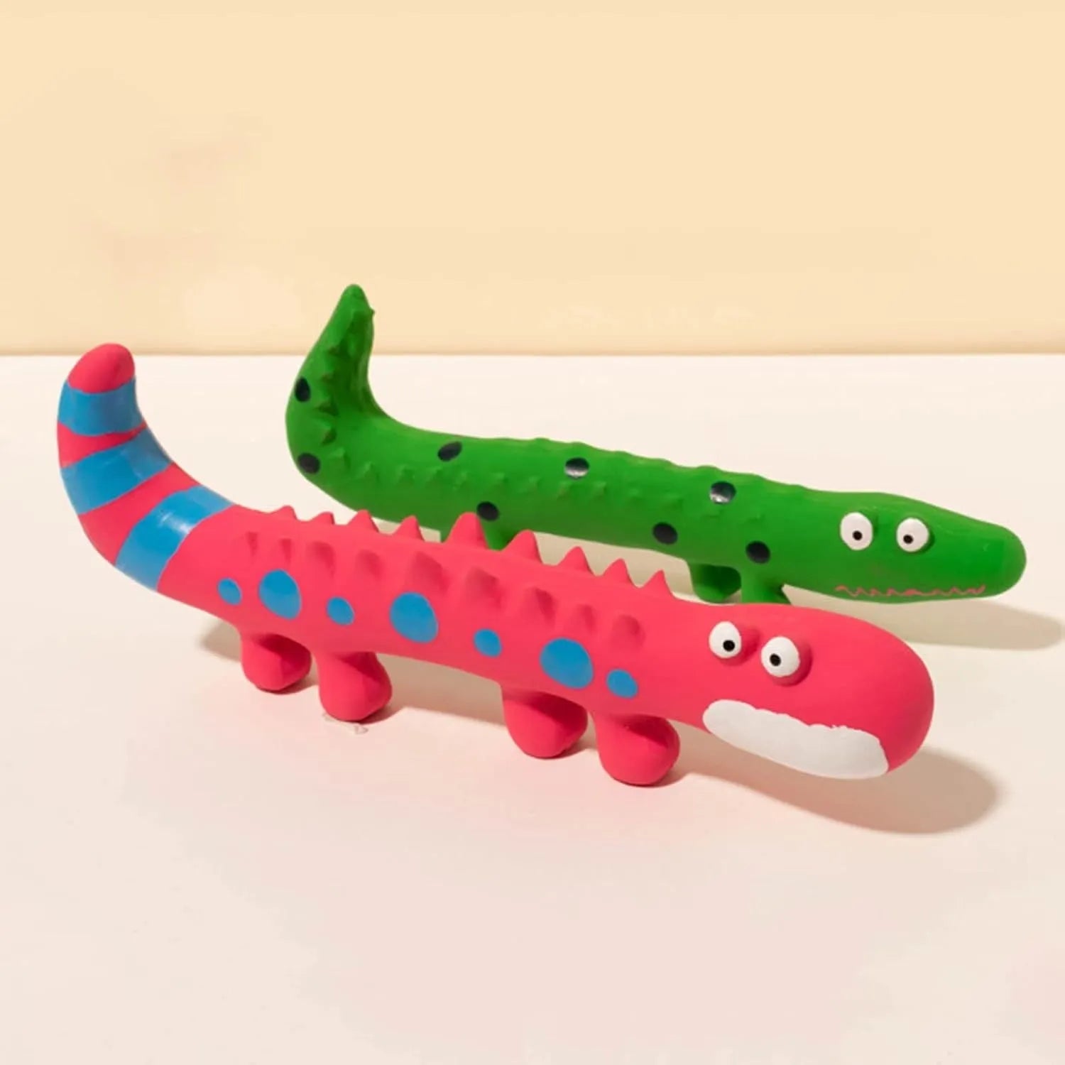 Green lizard-shaped dog chew toy with squeaker for aggressive chewing and teeth cleaning