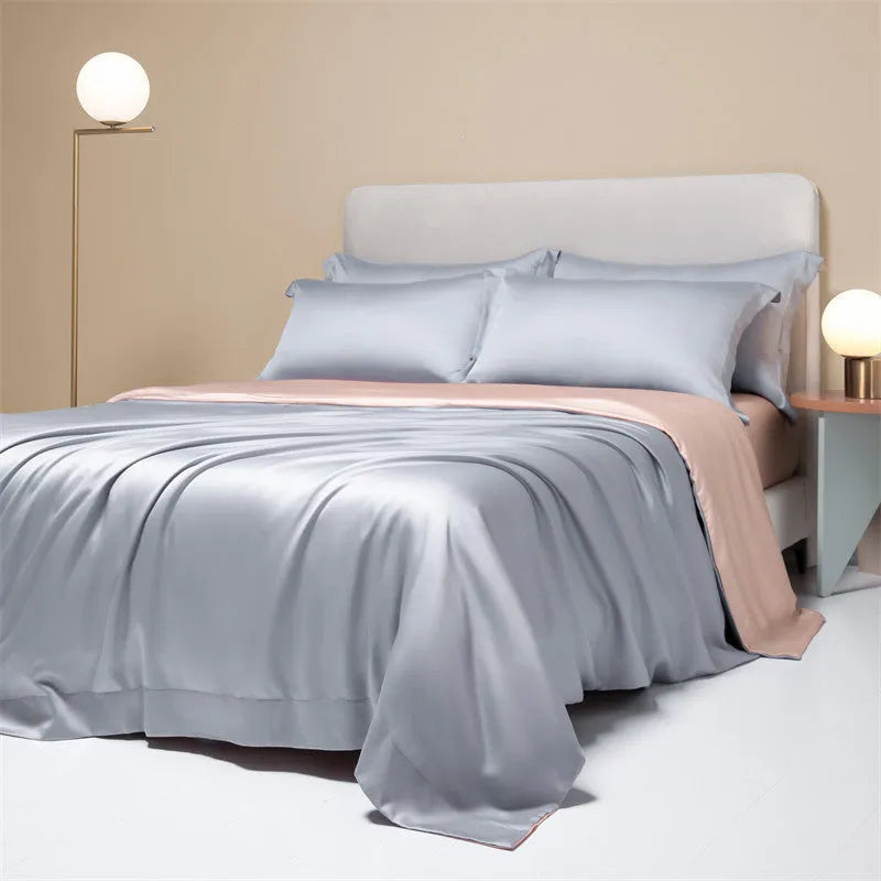 Luxury Lenzing Tencel quilt cover and pillowcase set in a modern style, showing colour options like Aurora Blue.