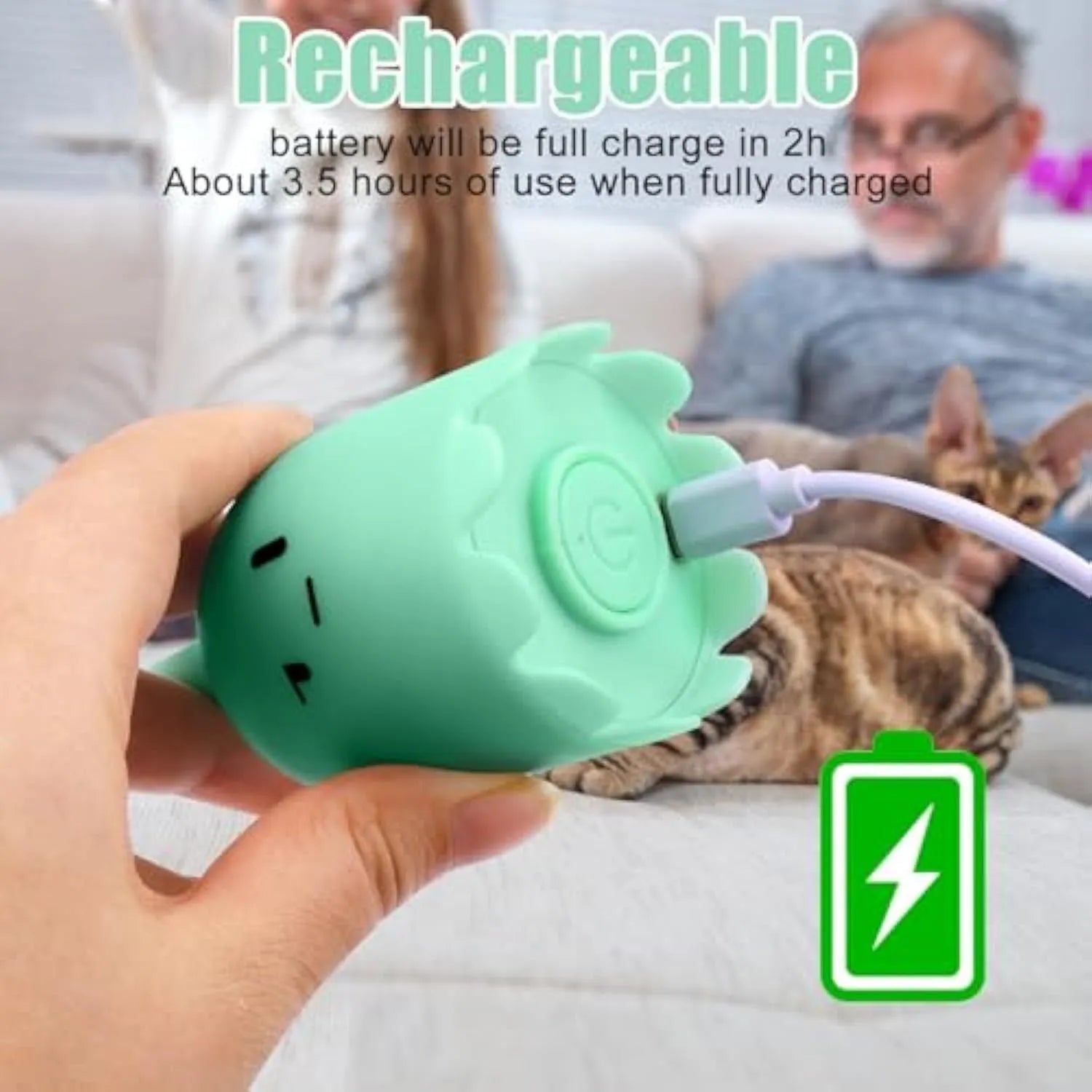 Green automatic cat toy with swinging silicone tails on a white surface