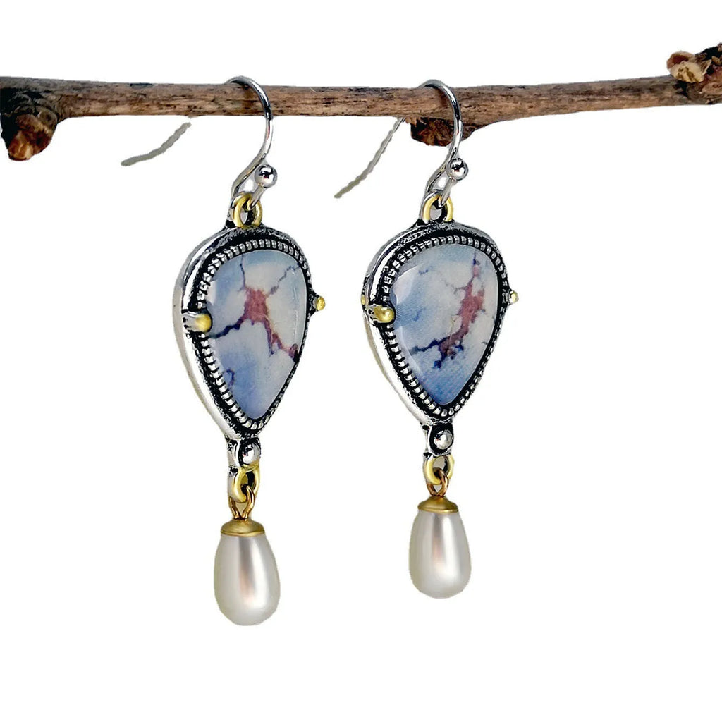 Retro blue drop earrings with geometric design featuring synthetic opal and pearl elements on electroplated metal
