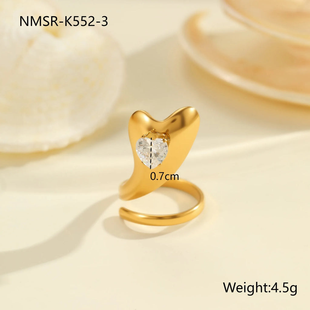 Geometric stainless steel zircon ring with open-mouth adjustable design on a hand.