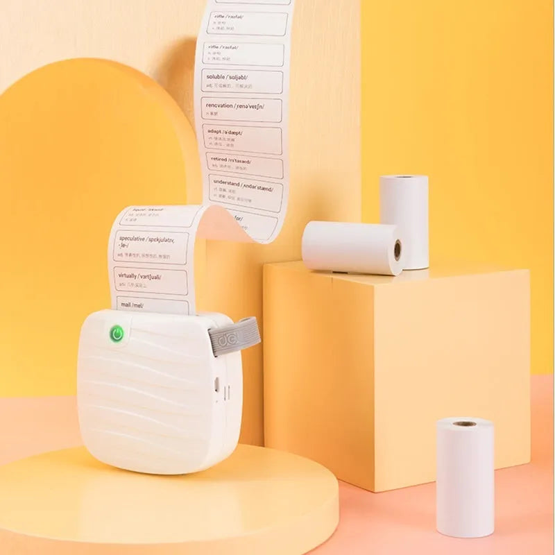 Three rolls of white 57mm wide thermal paper with a 30mm diameter, packaged together in a box.