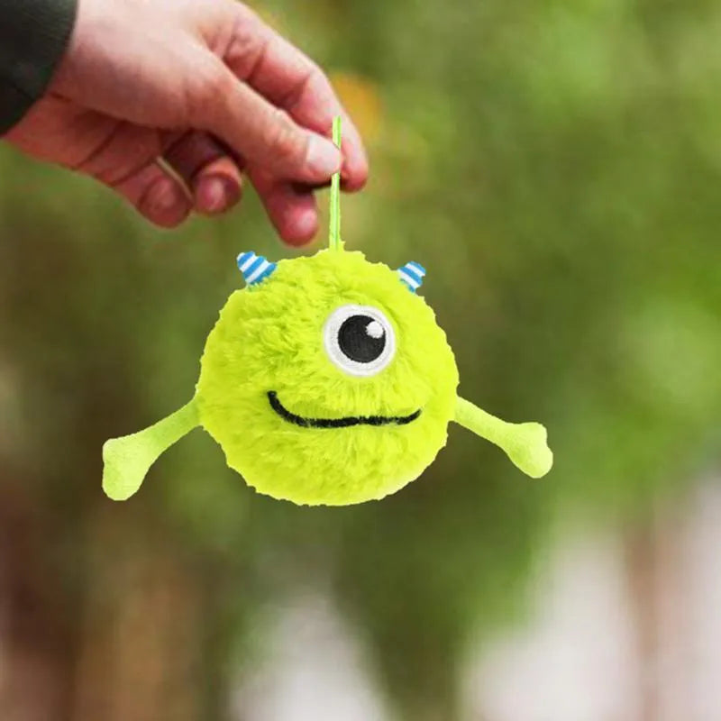 Green plush and TPR interactive sound-activated ball dog toy for teething puppies.